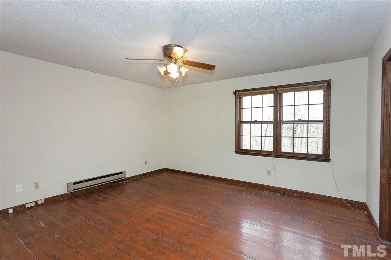 109 Neuse Harbor Drive Raleigh, NC 27610 - Photo 10 of 25 an empty room with a window