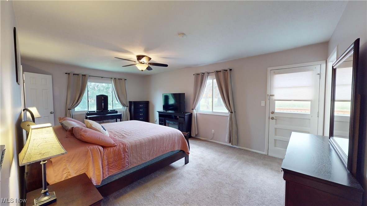 2630 Call Road Stow, OH 44224 - Photo 17 of 37 Bedroom with ceiling fan, light carpet, and multiple windows