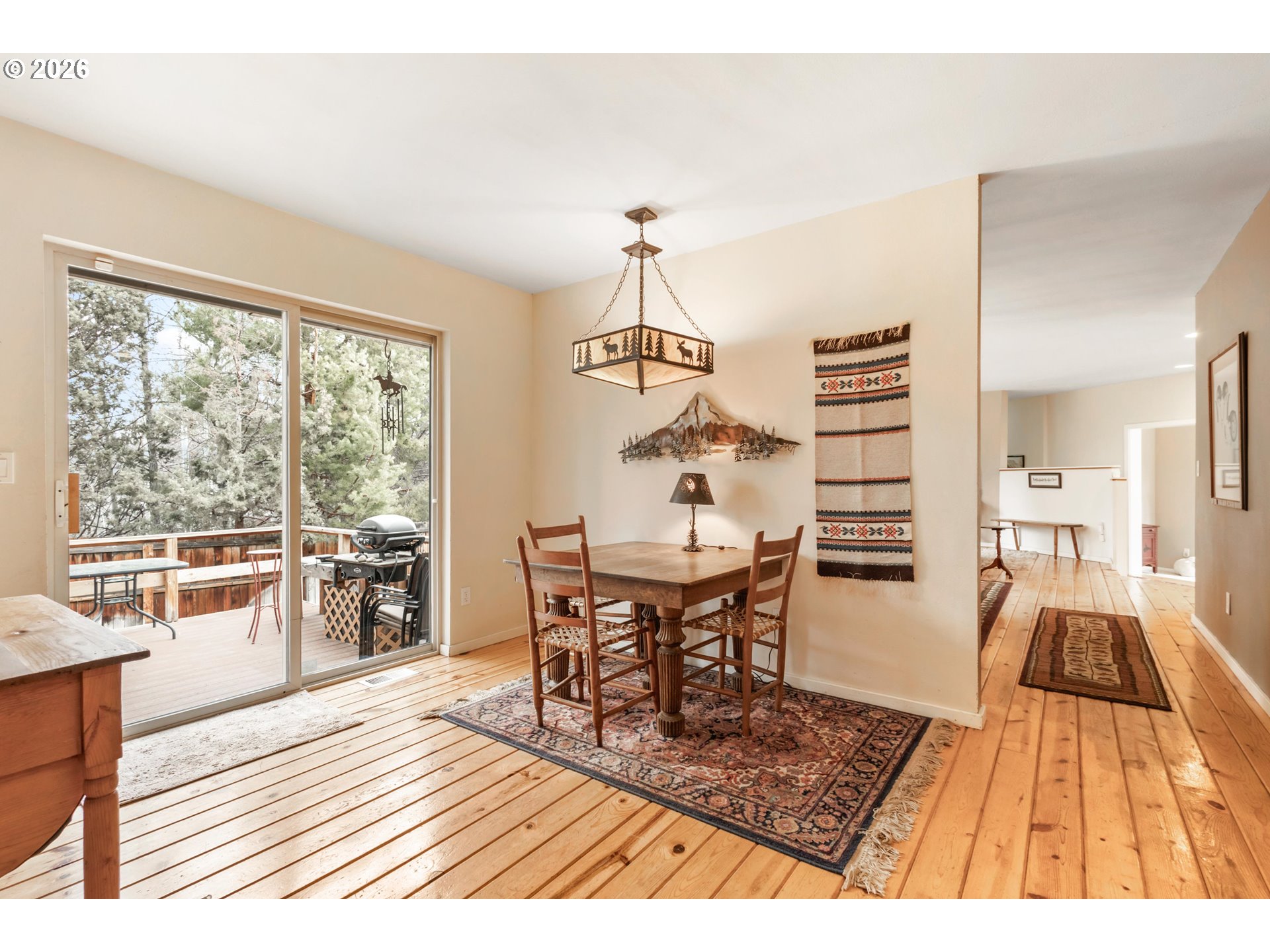 61082 Ferguson Court Bend, OR 97702 - Photo 14 of 48 a view of a dining room with furniture window and wooden floor