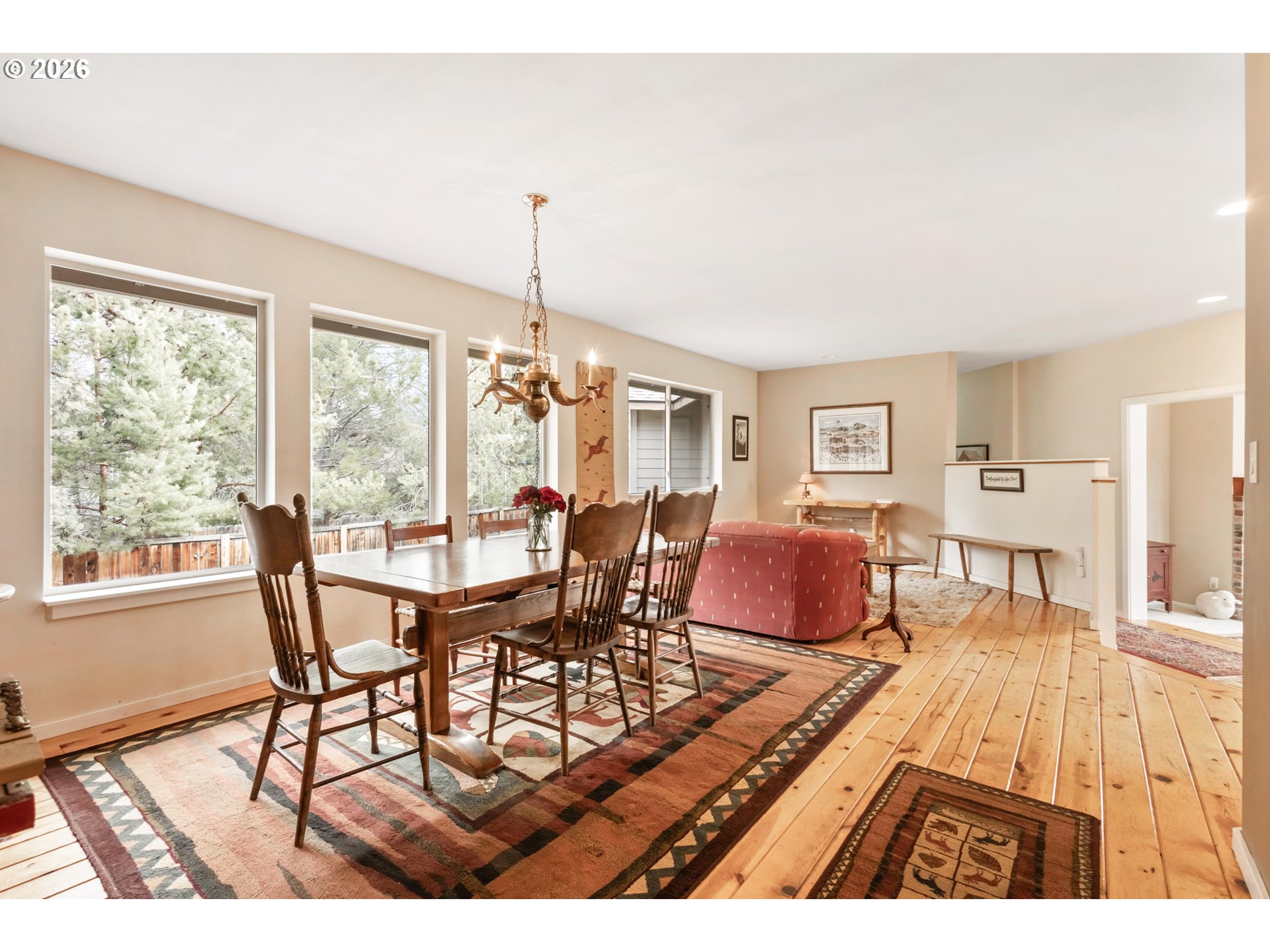 61082 Ferguson Court Bend, OR 97702 - Photo 15 of 48 a view of a dining room with furniture window and wooden floor