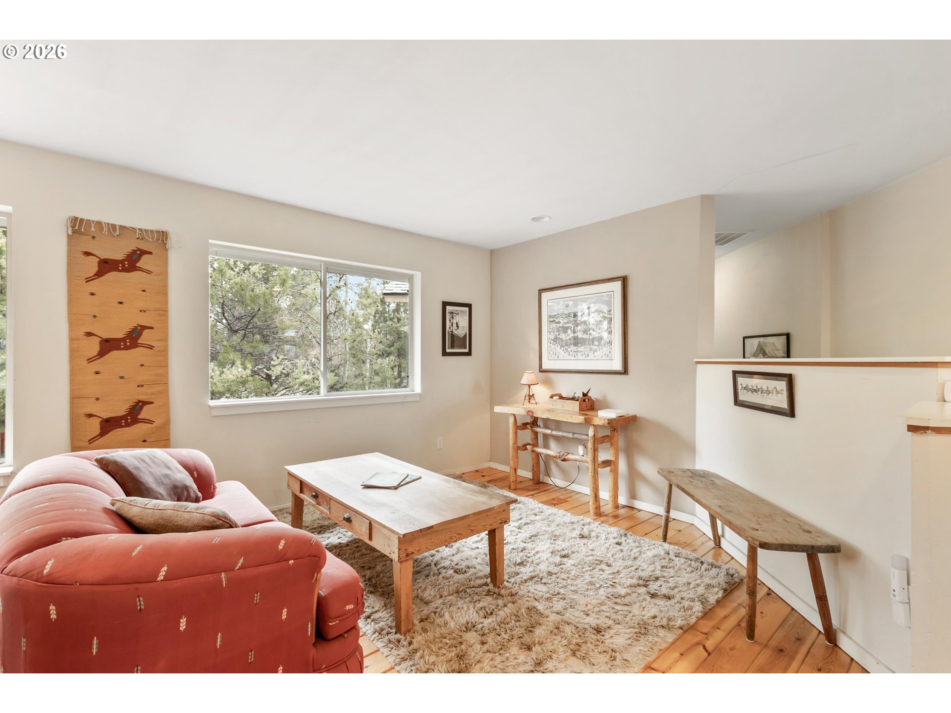 61082 Ferguson Court Bend, OR 97702 - Photo 18 of 48 a living room with furniture a table and a large window