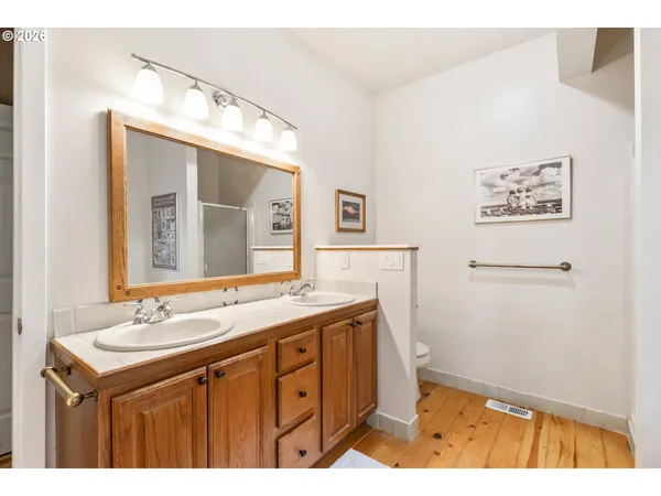 a bathroom with a sink a mirror and a toilet