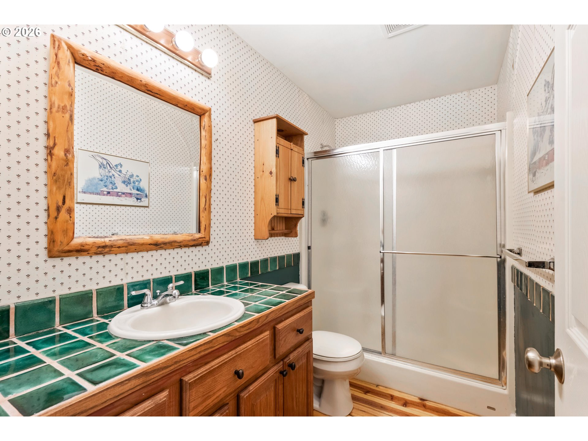61082 Ferguson Court Bend, OR 97702 - Photo 27 of 48 a bathroom with a granite countertop sink mirror vanity and toilet