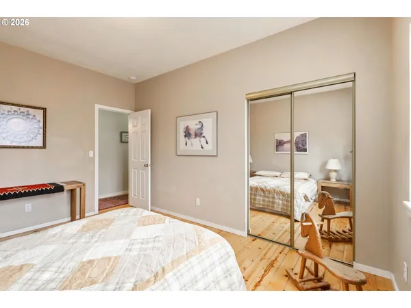 a bedroom with a bed and a cabinets