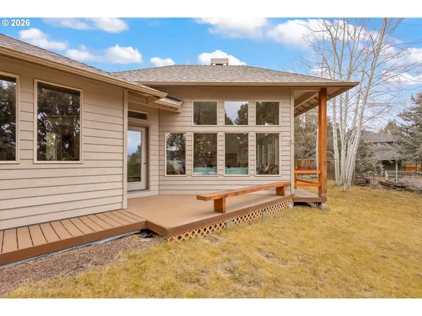 a front view of a house with a large window