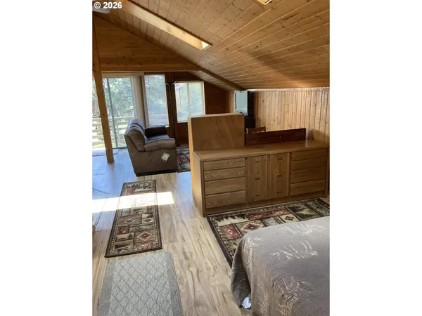 a living room with furniture and a rug