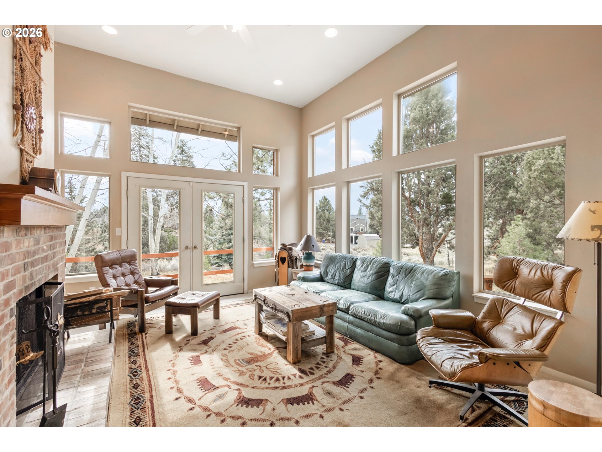 61082 Ferguson Court Bend, OR 97702 - Photo 6 of 48 a living room with furniture and floor to ceiling windows