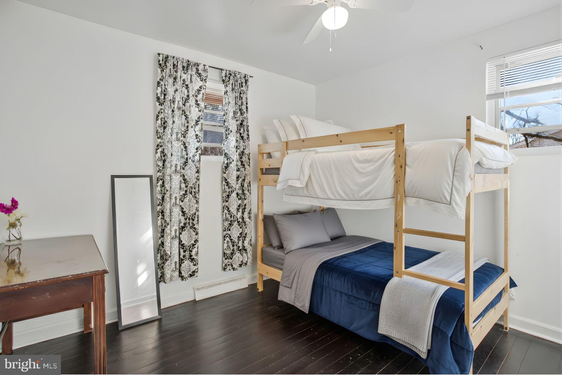 13704 Tower Road Brandywine, MD 20613 - Photo 13 of 15 a bedroom with a bed and a chair
