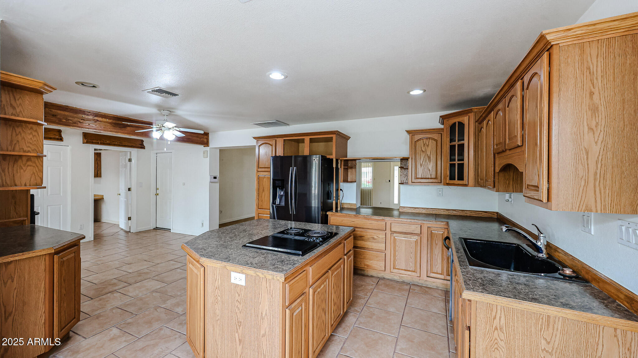 11851 North Thunderbird Road Sun City, AZ 85351 - Photo 9 of 46 a kitchen with stainless steel appliances a stove a sink and a refrigerator