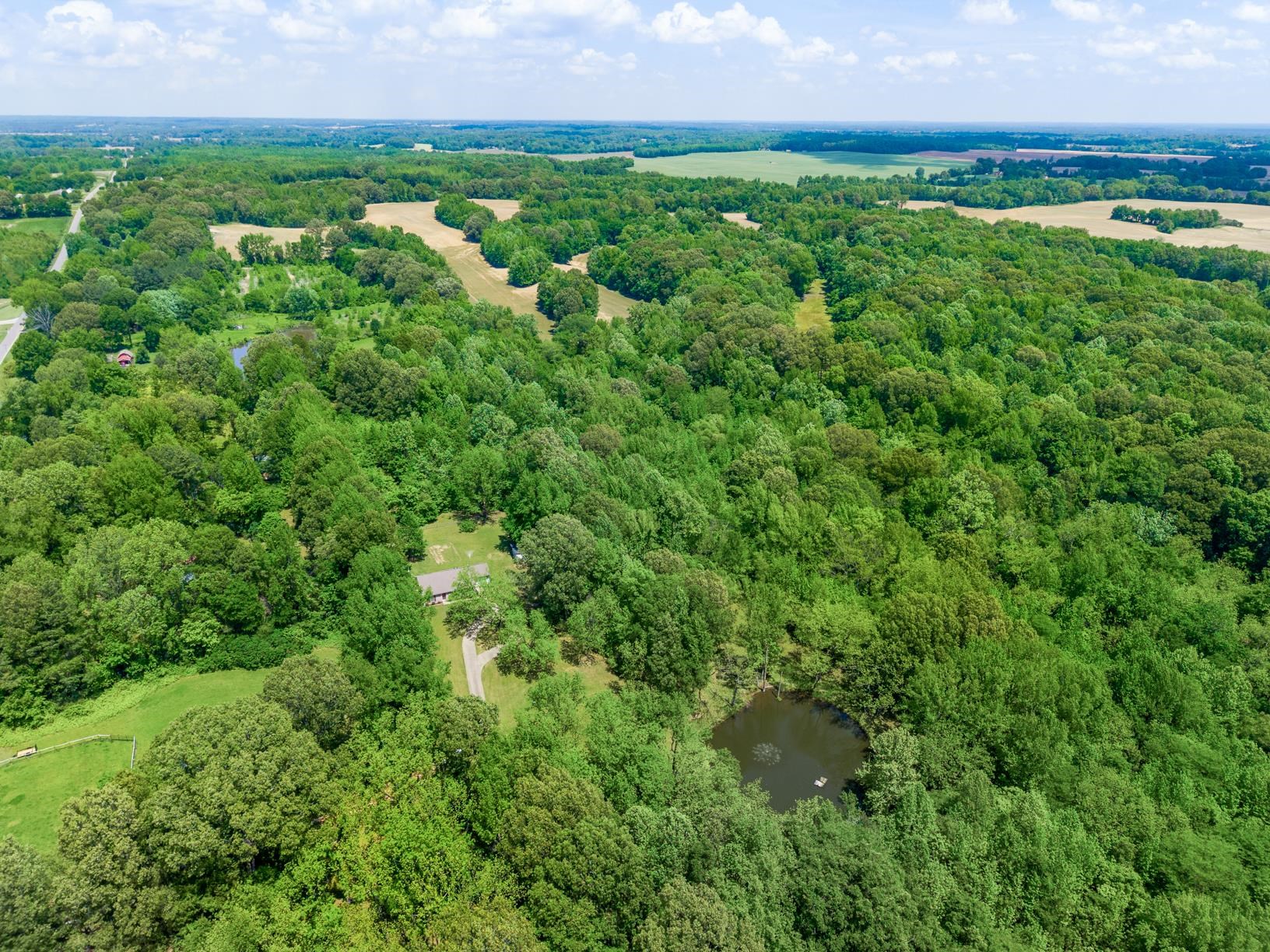 1876 Durhamville Road Ripley, TN 38063 - Photo 16 of 37 an aerial view of residential houses with outdoor space and trees