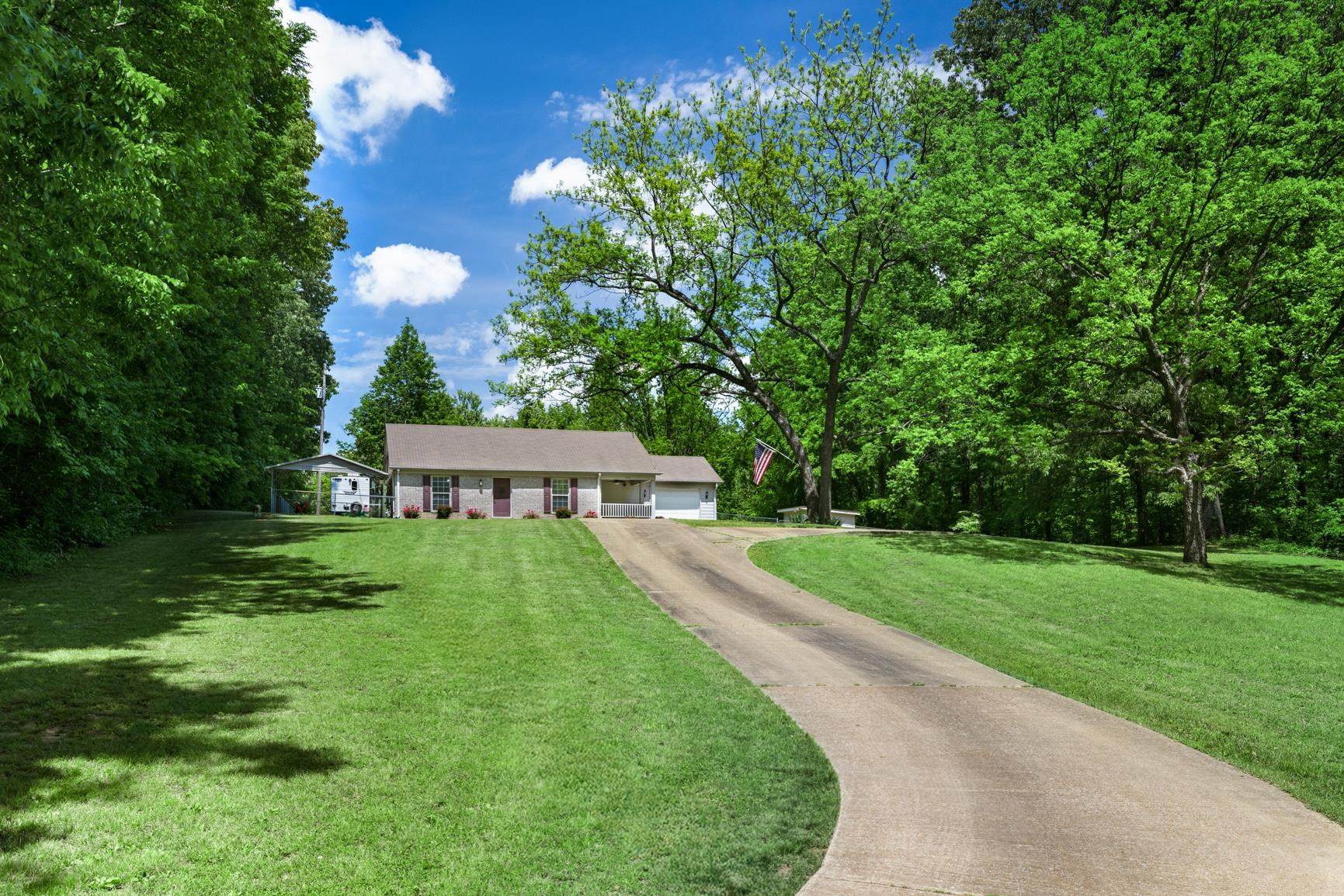 1876 Durhamville Road Ripley, TN 38063 - Photo 21 of 37 a view of a house with a yard and a large tree