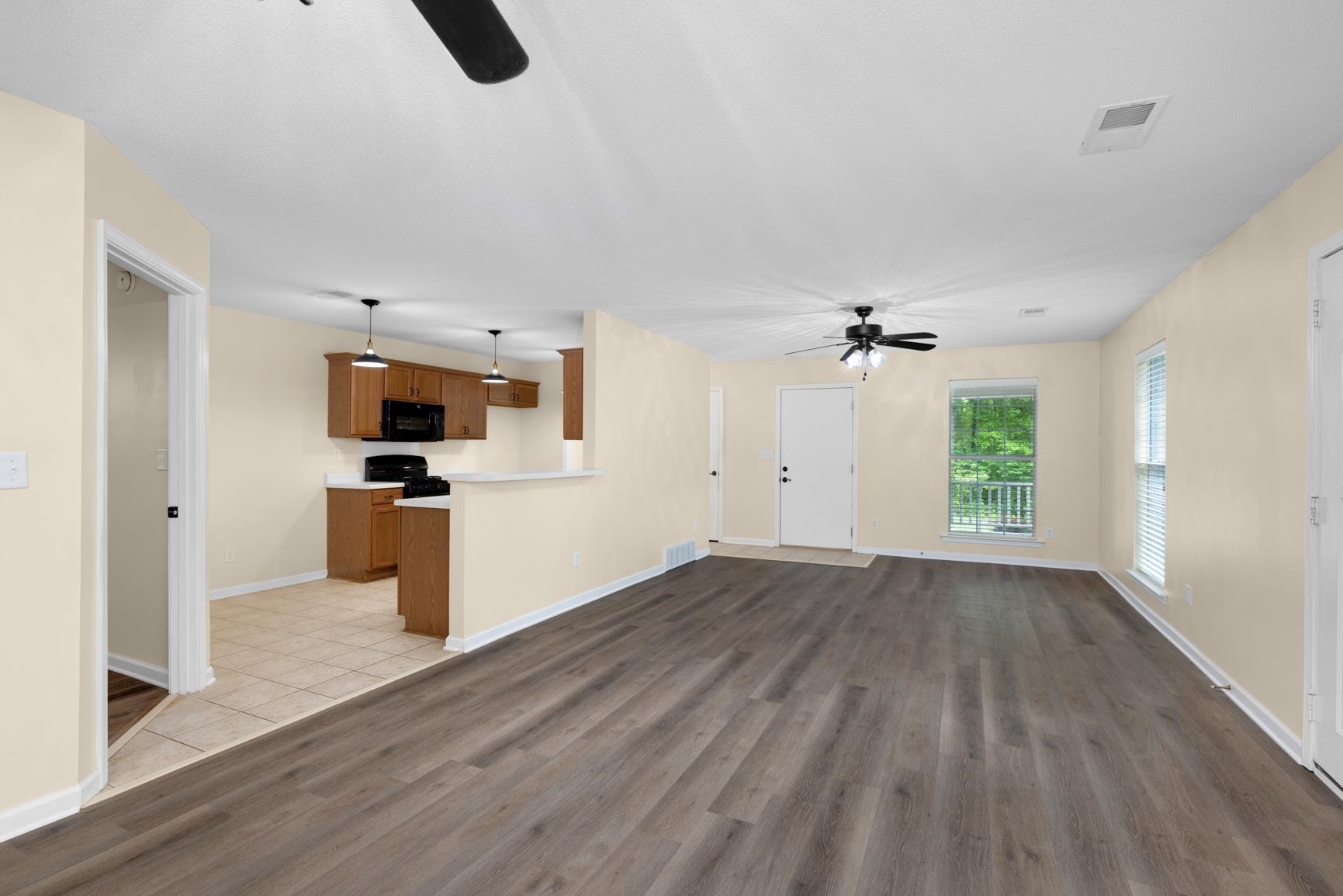1876 Durhamville Road Ripley, TN 38063 - Photo 29 of 37 an empty room with wooden floor and windows