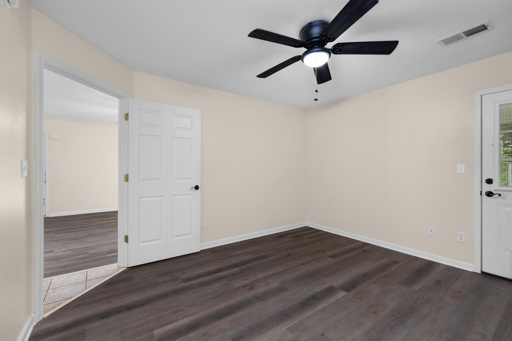 1876 Durhamville Road Ripley, TN 38063 - Photo 4 of 37 a view of an empty room with wooden floor