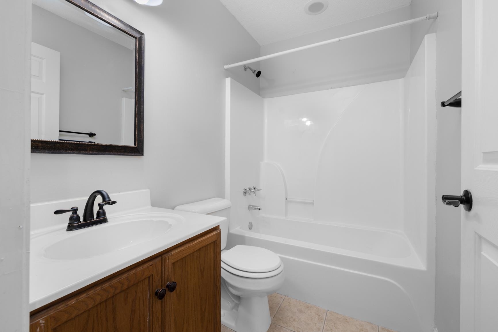 1876 Durhamville Road Ripley, TN 38063 - Photo 8 of 37 a bathroom with a sink a toilet and shower