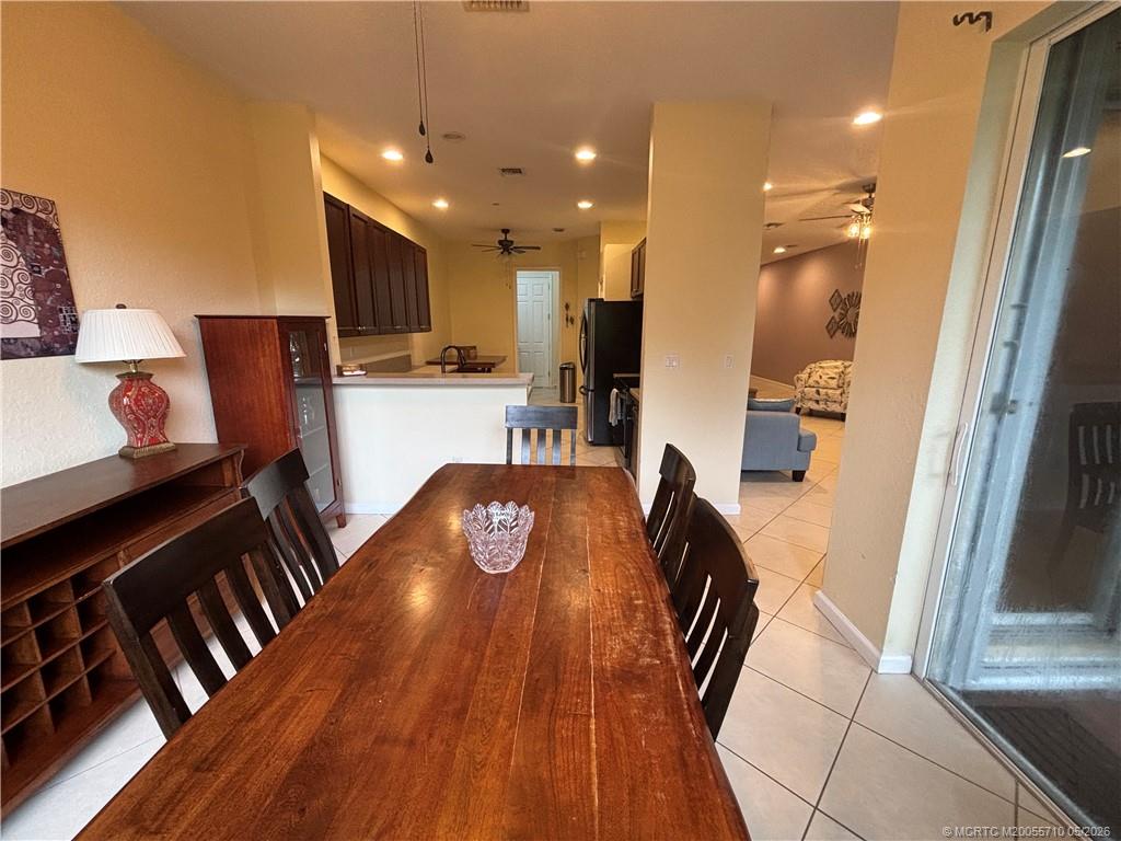 262 Southwest Walking Path, Unit 262 Stuart, FL 34997 - Photo 10 of 39 a view of kitchen with cabinets and wooden floor