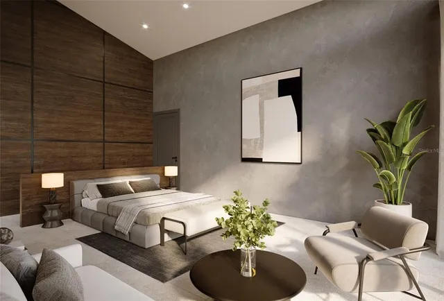 a bedroom with a large bed and a chandelier