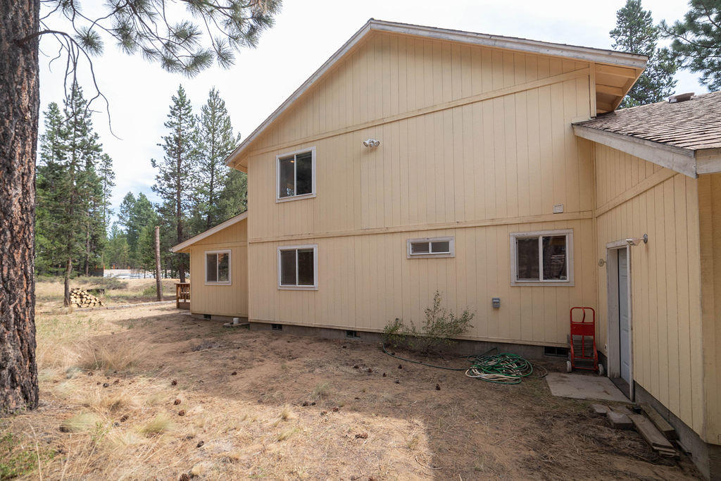 16944 Downey Road Bend, OR 97707 - Photo 35 of 44 a view of a white house with a yard