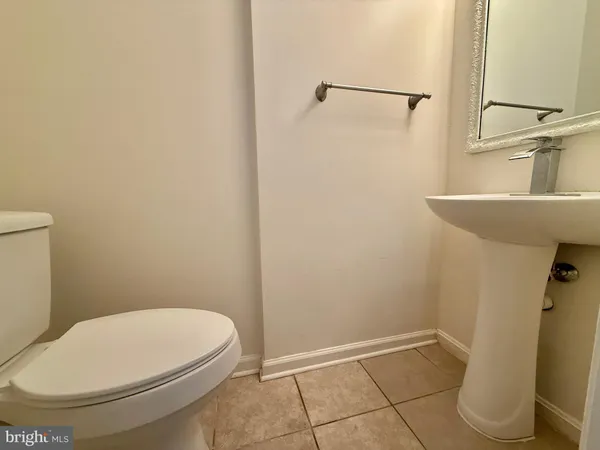 a bathroom with a toilet and a sink
