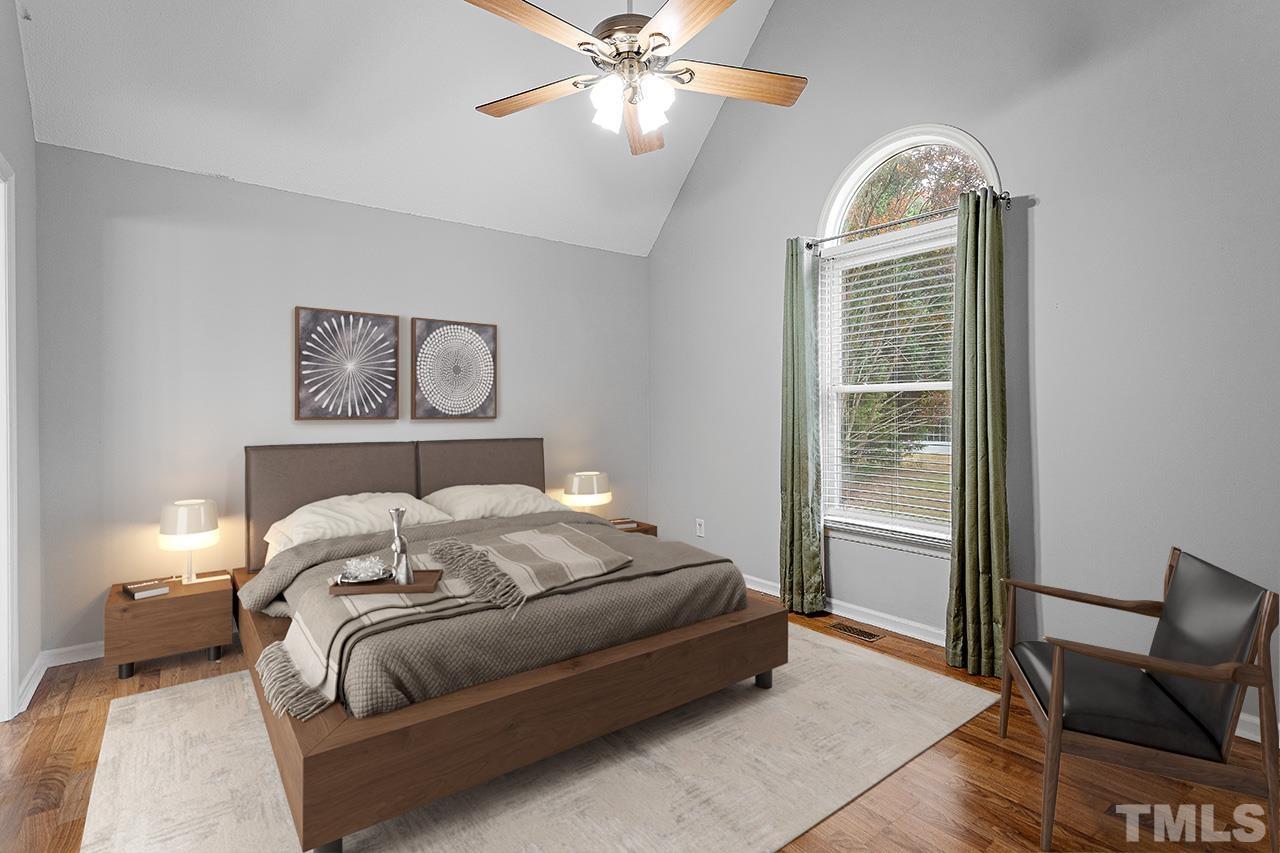 53 Phil Johnson Road Sanford, NC 27330 - Photo 13 of 29 a bedroom with a large bed and a window