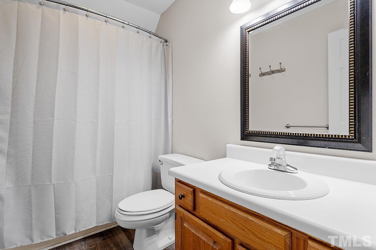 53 Phil Johnson Road Sanford, NC 27330 - Photo 19 of 29 a bathroom with a sink and a toilet