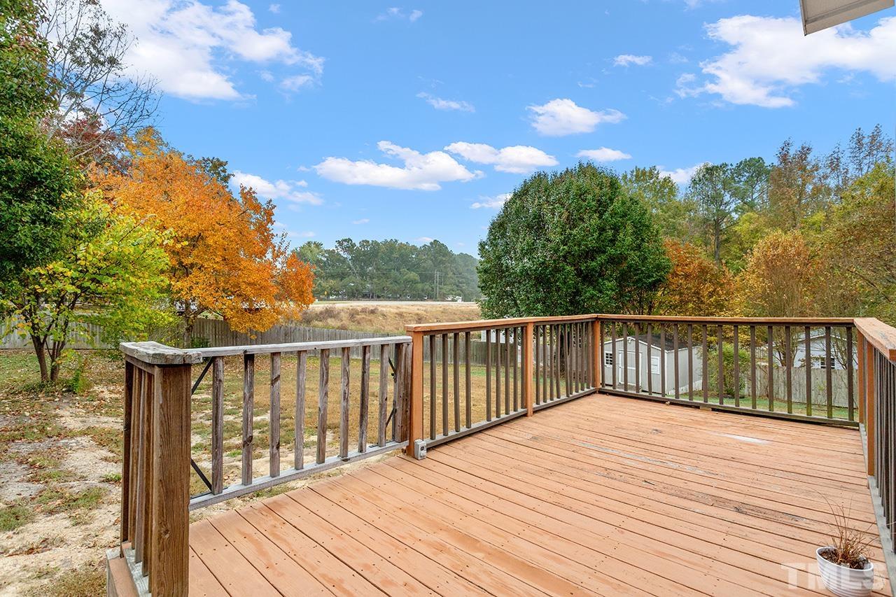 53 Phil Johnson Road Sanford, NC 27330 - Photo 25 of 29 a balcony with wooden floor and fence