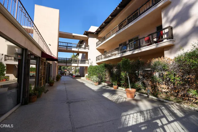 a view of a building with sitting area