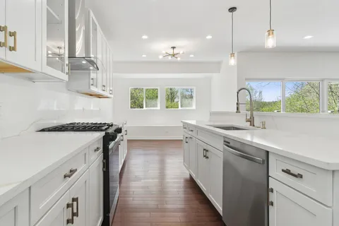 a kitchen with a sink and a refrigerator