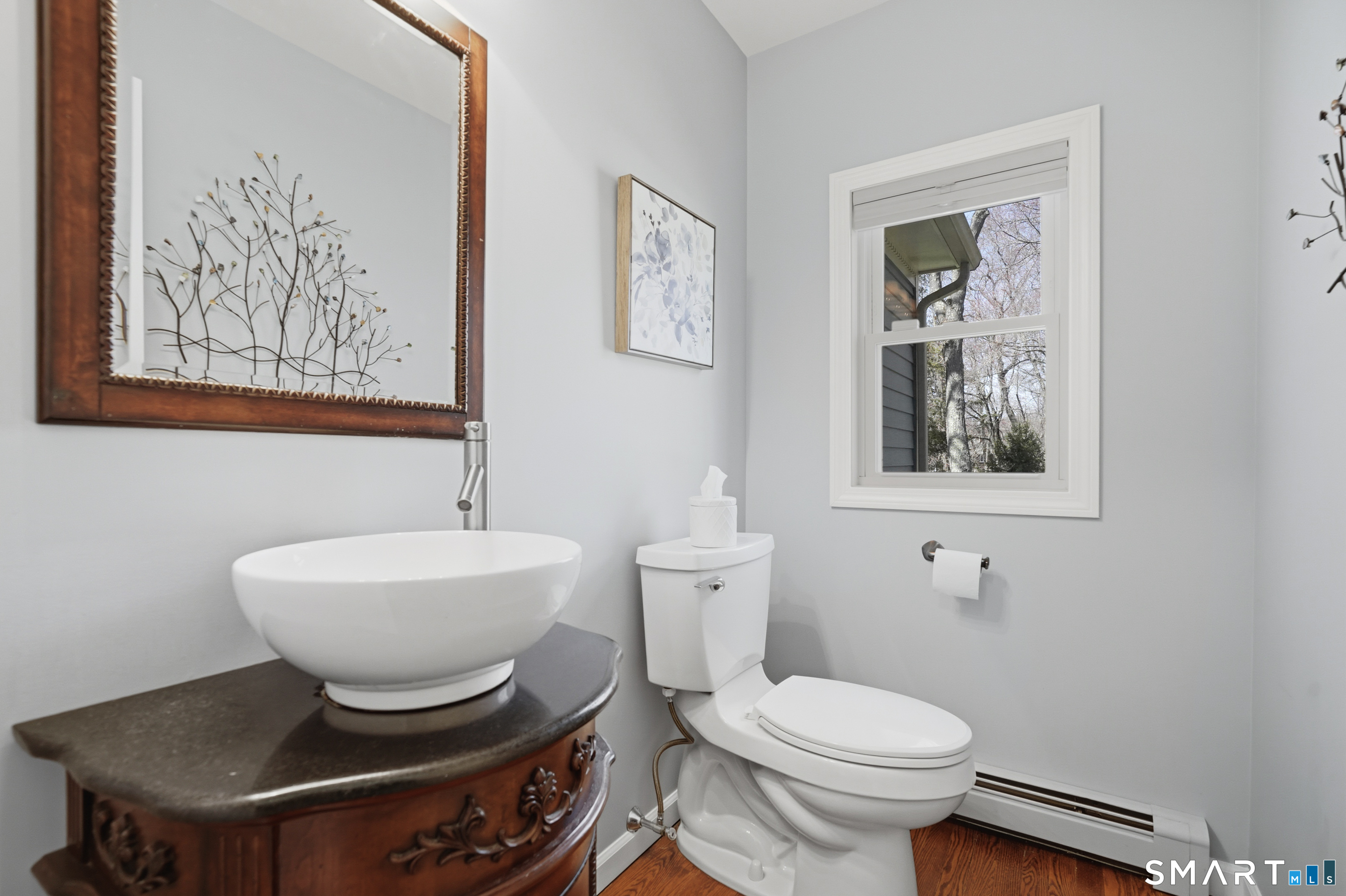 21 Shawnee Lane Monroe, CT 06468 - Photo 20 of 39 a bathroom with a toilet a sink and mirror
