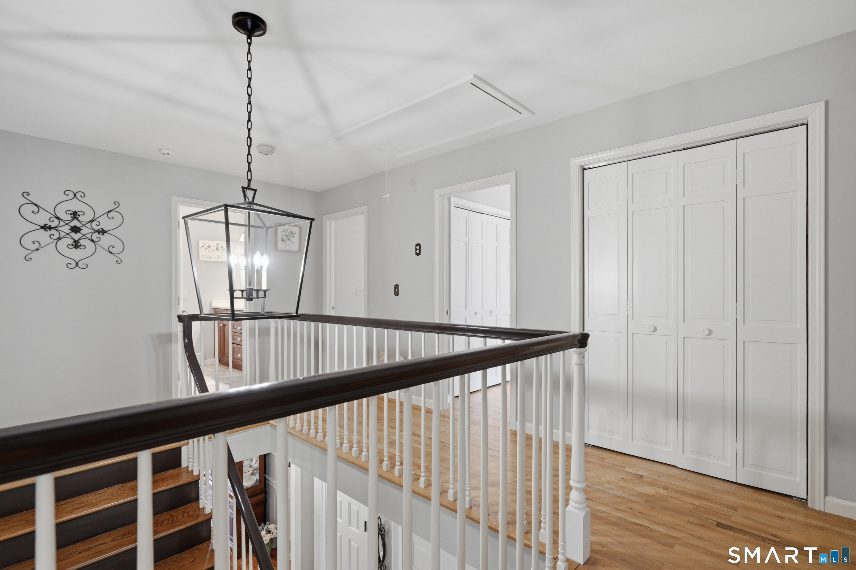 21 Shawnee Lane Monroe, CT 06468 - Photo 23 of 39 a view of a hallway view with wooden floor and staircase