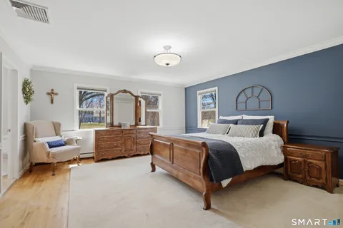 a bed room with a bed and furniture