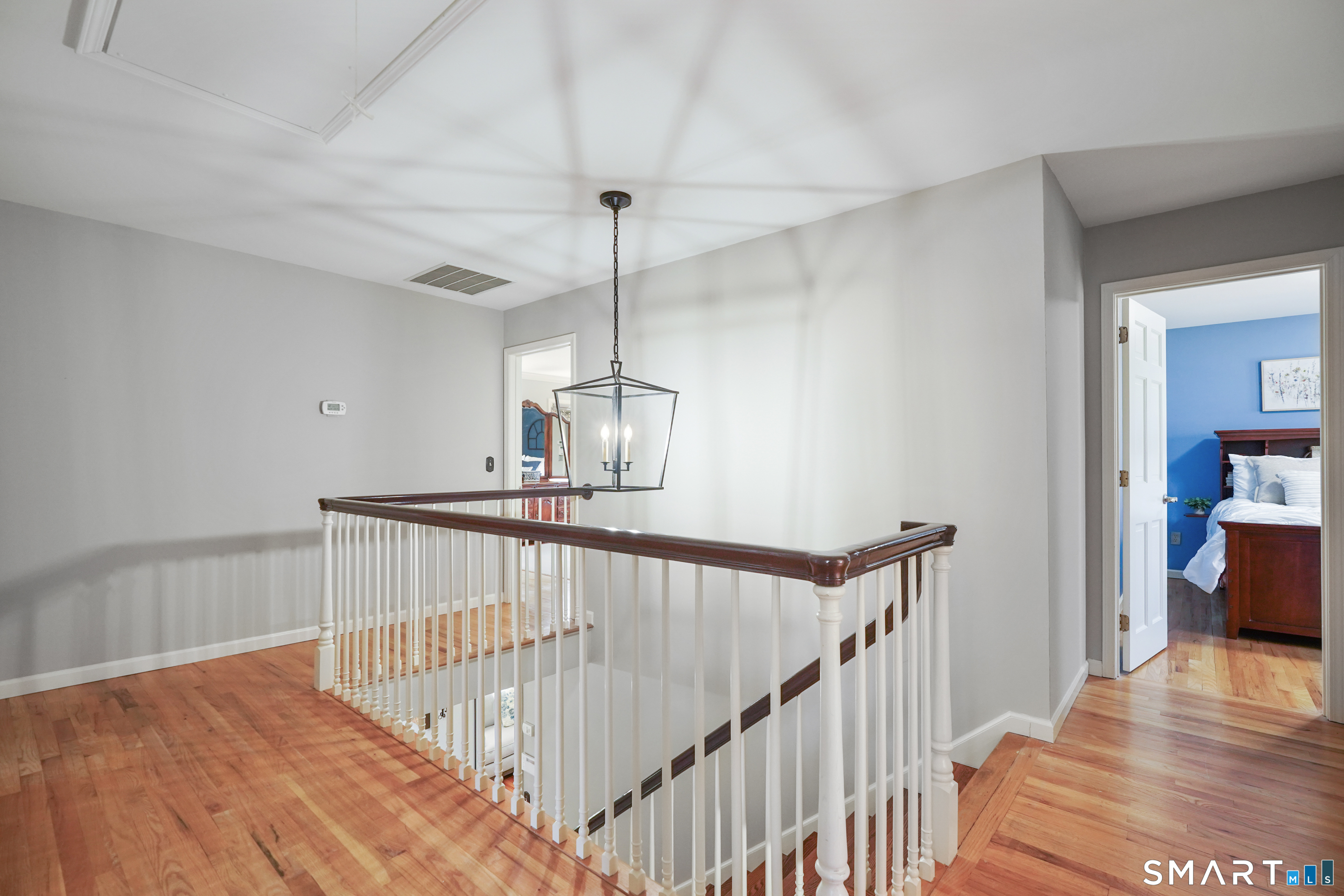 21 Shawnee Lane Monroe, CT 06468 - Photo 26 of 43 a view of entryway and hall with wooden floor