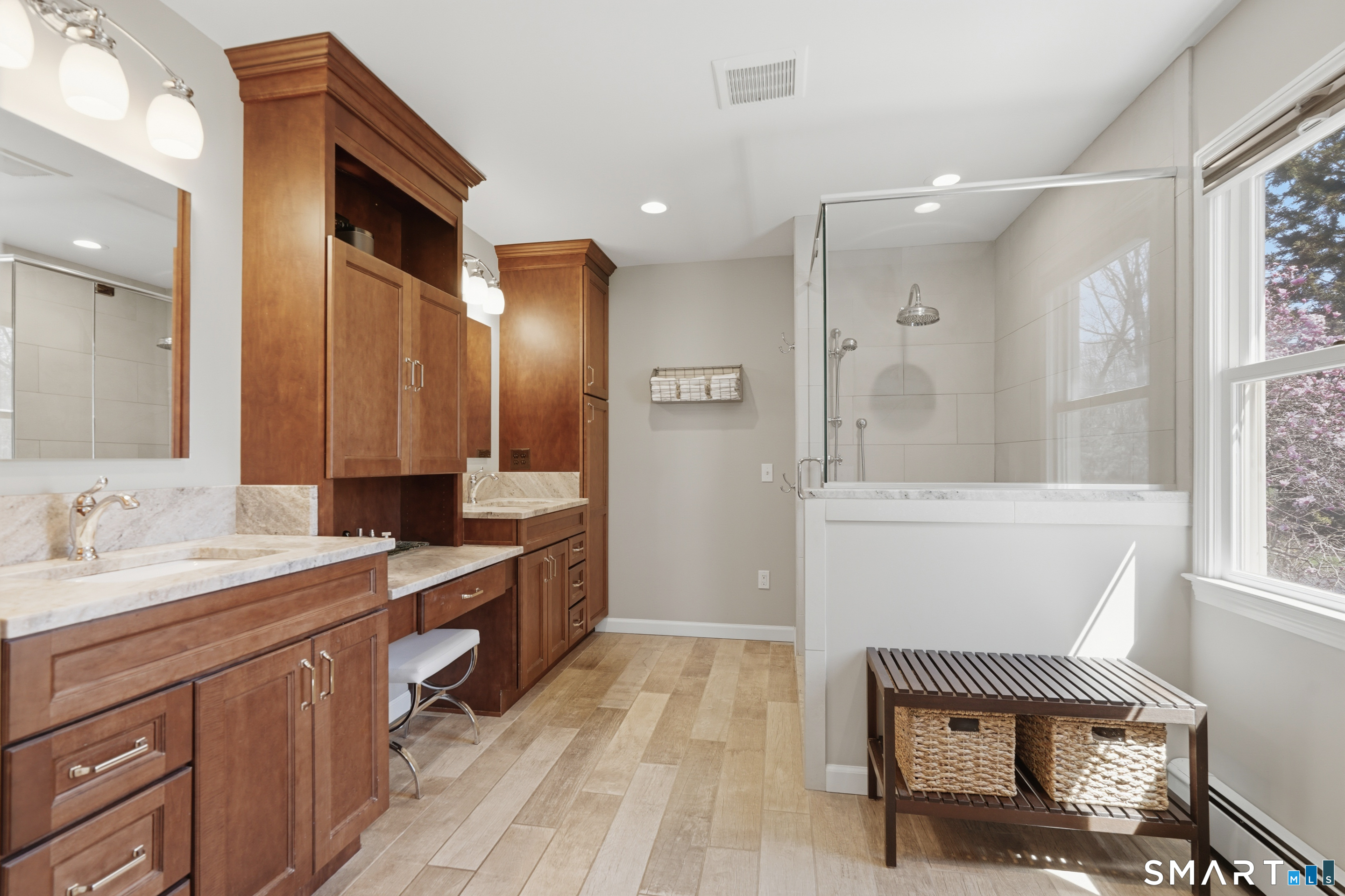 21 Shawnee Lane Monroe, CT 06468 - Photo 29 of 43 a spacious bathroom with a mirror sink and bathtub