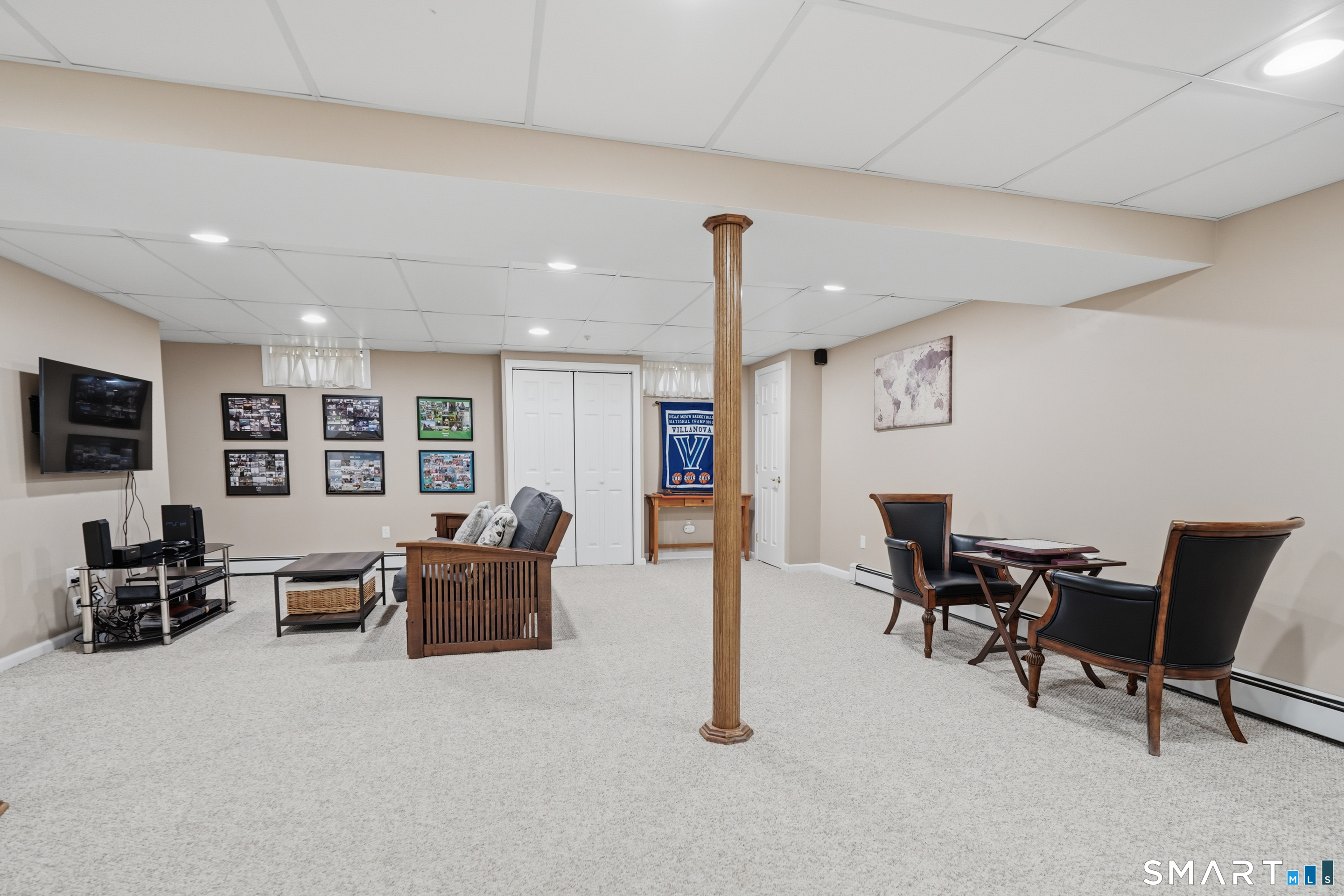 21 Shawnee Lane Monroe, CT 06468 - Photo 35 of 43 a living room with furniture and a flat screen tv