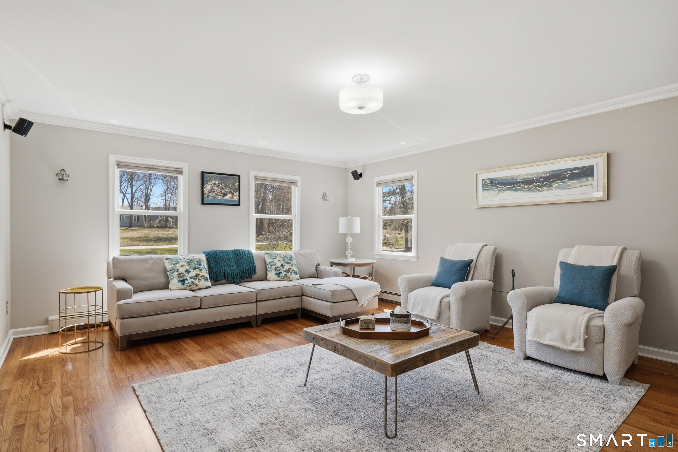 21 Shawnee Lane Monroe, CT 06468 - Photo 8 of 43 a living room with furniture and a wooden floor