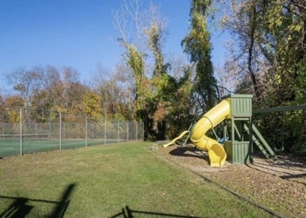 22 Westgate Road, Unit 3 Boston, MA 02467 - Photo 16 of 18 a view of a park with iron fence