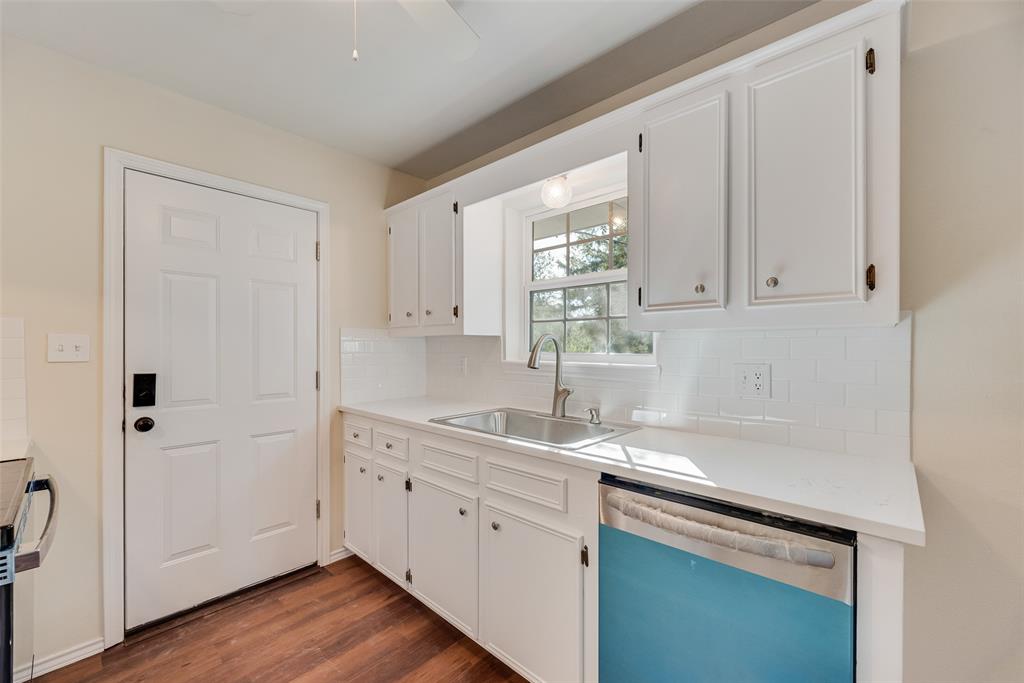 751 County Road 1240 Mount Pleasant, TX 75455 - Photo 21 of 35 a kitchen with a sink cabinets and window
