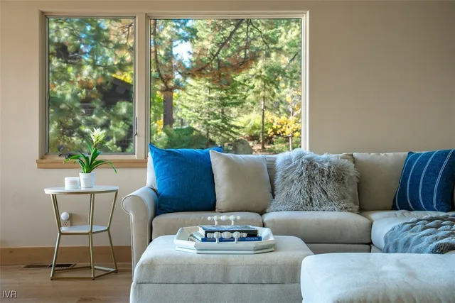 a dining room with furniture window and wooden floor