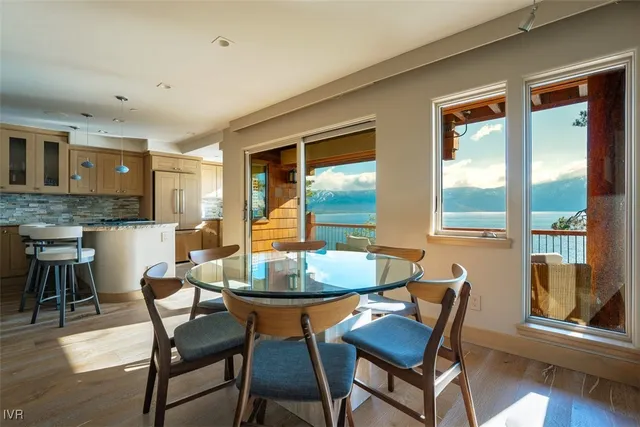 a balcony with furniture and wooden floor