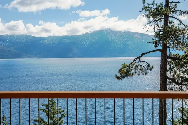 a bedroom with furniture and a large window