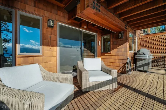 a living room with furniture wooden floor and a fireplace