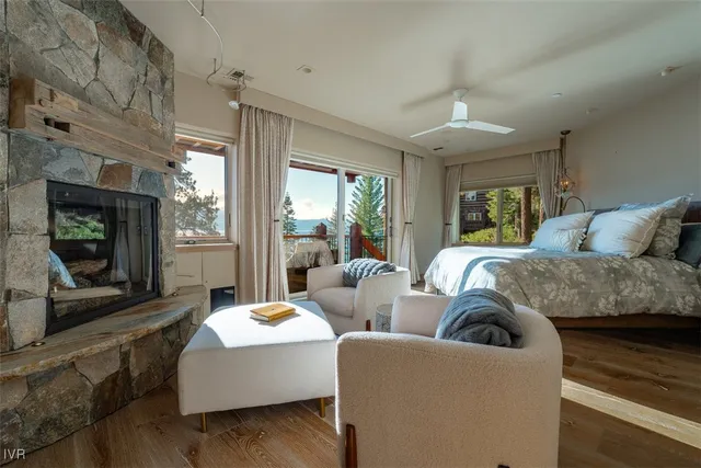 a bathroom with a granite countertop double vanity sink and a mirror
