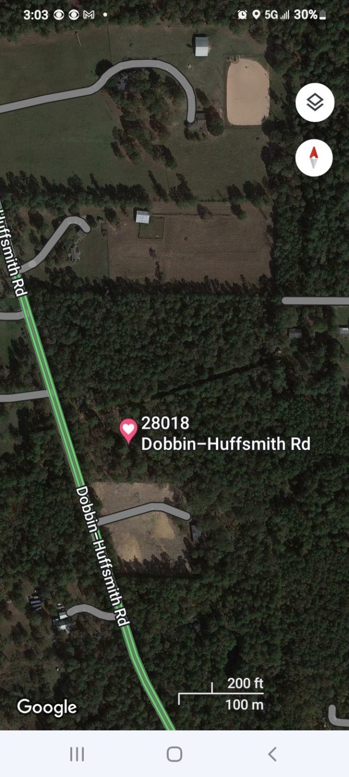 28018 Dobbin-Huffsmith Road Magnolia, TX 77354 - Photo 3 of 7 a bathroom with a granite countertop sink and a mirror