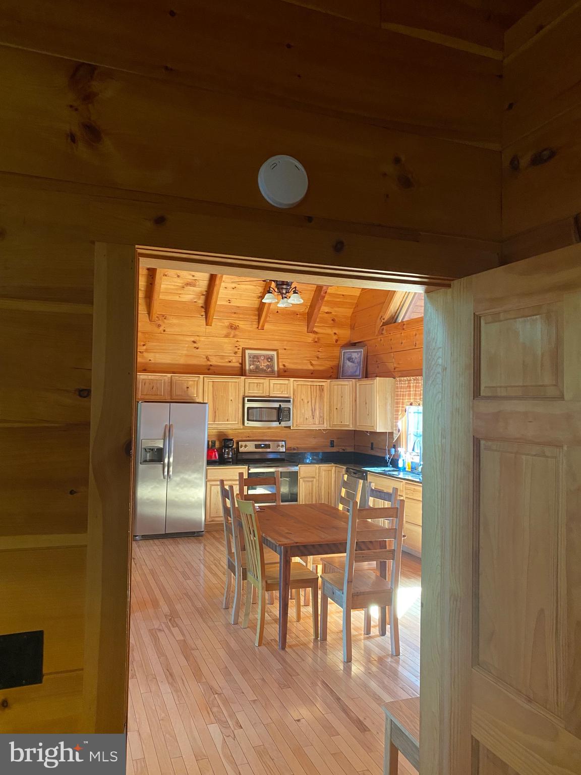 550 Cross Mountain Road Luray, VA 22835 - Photo 12 of 14 a view of a dining room with furniture and wooden floor