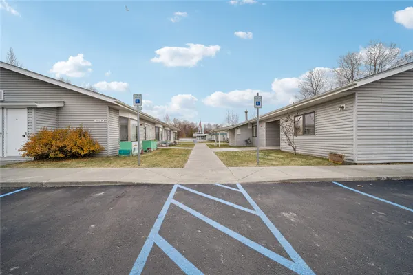 a view of a house with basketball court