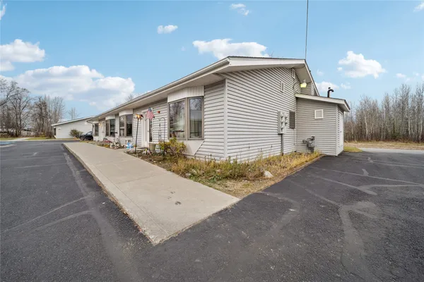 a view of a house with a backyard