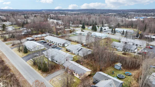 an aerial view of a house with outdoor space