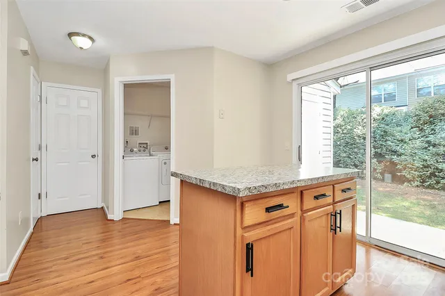 a view of a kitchen from the hallway