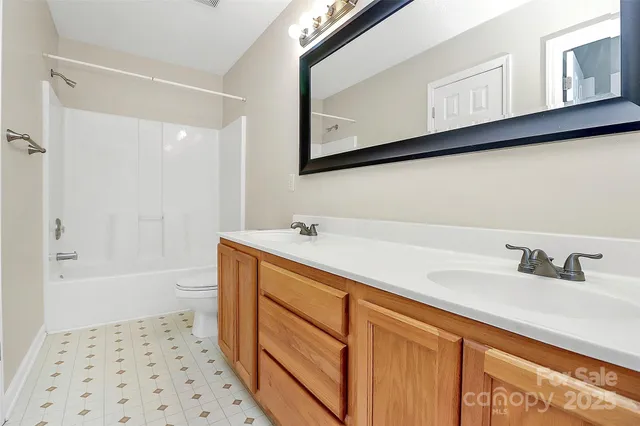 a bathroom with a sink a mirror and a bathtub