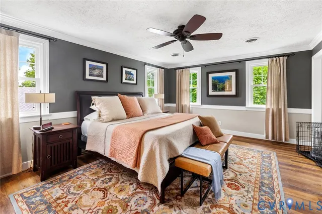 a bed room with a bed and a window