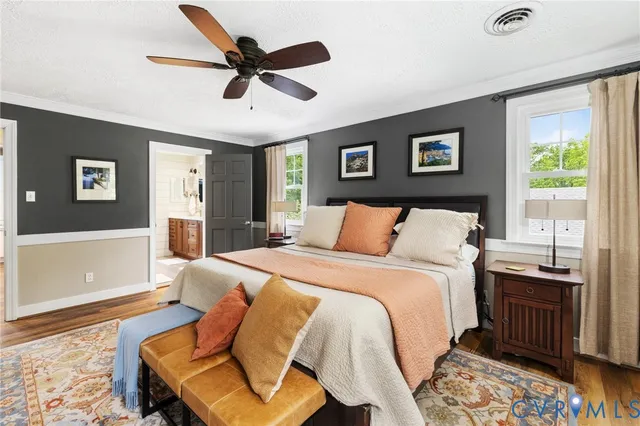 a spacious bathroom with a double vanity sink a mirror and a bathtub